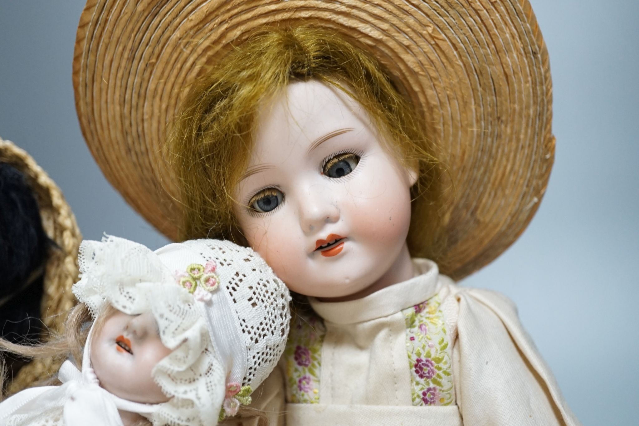 An Armande Marseille 1894 bisque doll, and two other bisque dolls